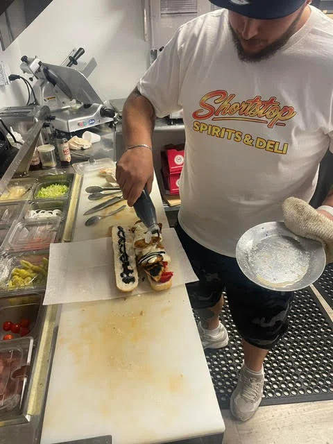 Sandwich being made at Shortstop Spirits & Deli