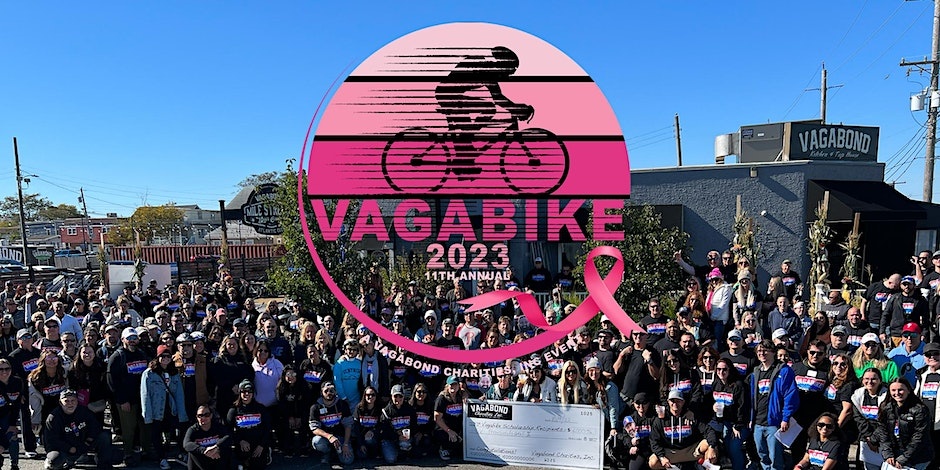 Vagabike 2023 logo over a large group photo of riders outside Vagabond holding a ceremonial check